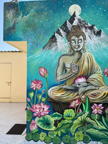I painted this large Buddha mural for an open terrace in Ahmedabad, creating a peaceful lounge vibe. The galaxy background and lotus flowers give it a scenic, meditative quality.