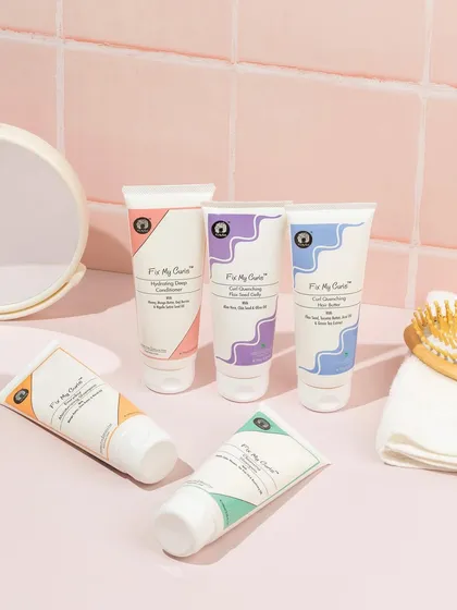 We created a realistic bathroom counter scene for this curly hair care line. The pink tiles, mirror, and brush help customers visualize the products as part of their daily routine.