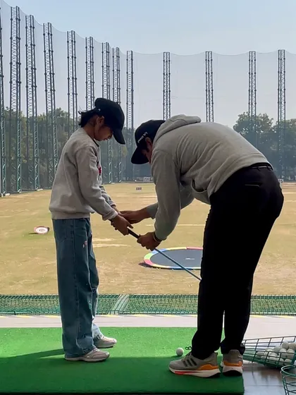 It all starts with the right foundation. Here, one of our coaches is teaching a junior player the correct way to hold the club, ensuring good habits from the very beginning.