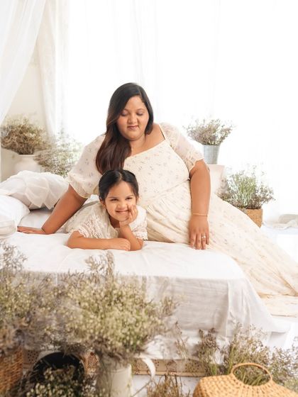 A mother and daughter portrait that is both sweet and stylish. The simple, light-filled setup keeps the focus entirely on their connection.