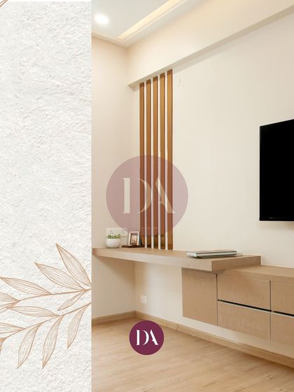 A minimalist TV unit in a bedroom, featuring clean lines and natural wood tones. The vertical wooden slats add a touch of texture, creating a functional and stylish focal point.