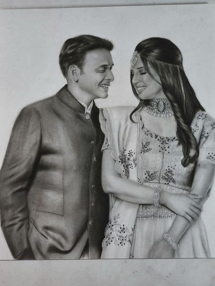 A beautiful portrait of a couple dressed in formal wear, capturing a candid, happy moment.