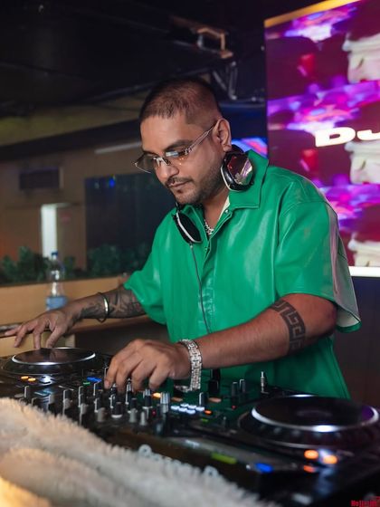 In the zone at No Limmits, mixing tracks for a full-on Bollywood night. The green shirt was for the money-themed vibe of the night.