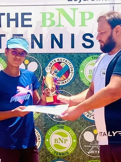 Our player Khushi Sharma receiving her winner's trophy for the CS7 U-14 girls' singles category at a BNP Tennis event.