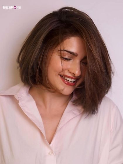 A candid, smiling shot of Prachi Desai's new bob, showing off its playful movement and texture.
