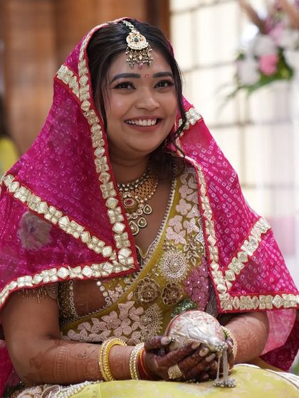 The radiant bride during her 'Paath Bithai', a pre-wedding prayer ceremony. We ensure these traditional rituals are conducted in a serene and beautiful environment, filled with blessings.