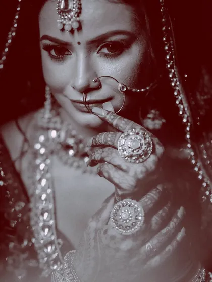 The bride is the heart of the story. This classic, moody black and white bridal portrait focuses on her elegance and emotion, capturing the timeless beauty of her look with dramatic lighting.