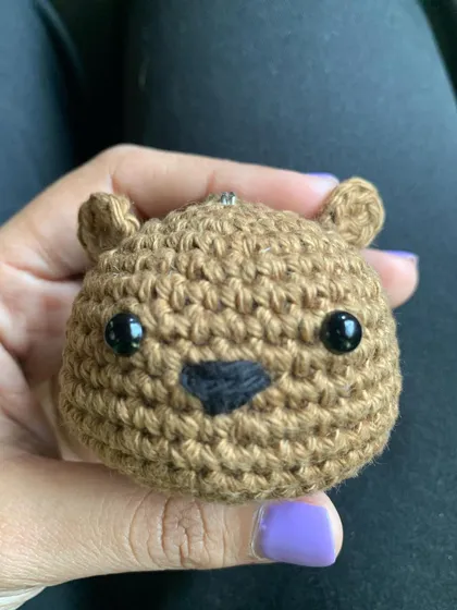 I love the simple expression on this handmade bear charm. It’s a classic amigurumi style that’s always a favorite.