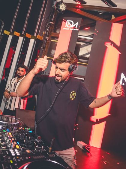 A thumbs-up from the console at Flo. It's a small gesture to the crowd, letting them know I appreciate their energy.