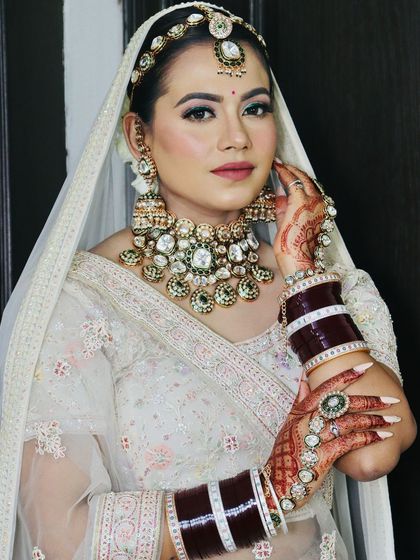 A full portrait of the bride, showcasing her complete modern bridal look.