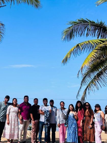 A group photo under the palm trees on a sunny beach in Gokarna. This is what weekend getaways are made of.