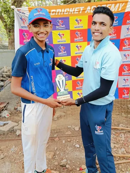 A coach presents the Man of the Match award to a U-14 player for a game-winning performance. These awards boost confidence after every match.
