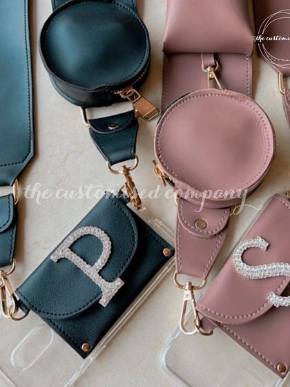 Go hands-free with these elegant mobile sling covers. Available in sophisticated colors like dusty rose and deep teal, they can be personalized with a diamond-embellished initial for a touch of bling.