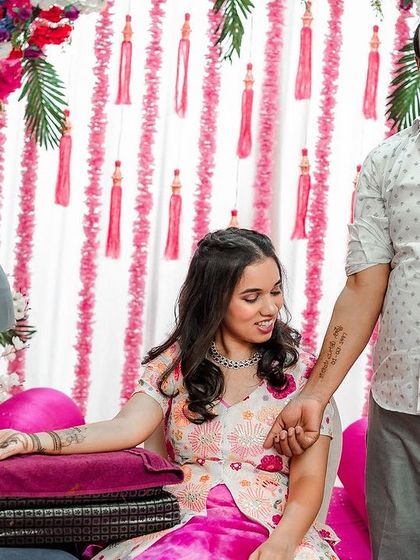 A sweet moment during a mehendi ceremony, where a father proudly shows his daughter the tattoo of her name he got etched on his arm. It's these personal stories that make our work so meaningful.