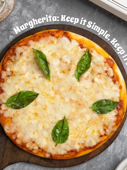 You can't go wrong with a classic Margherita Pizza. Ours features a tangy tomato sauce, plenty of mozzarella cheese, and fresh basil leaves on a perfectly baked crust.