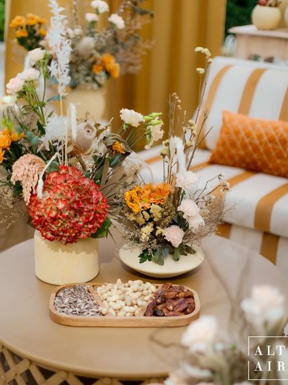 Details from our 'Markets of the Middle East' theme in Doha. A tray of dates and nuts sits beside dried floral arrangements, reflecting the earthy and authentic vibe of a traditional souq.