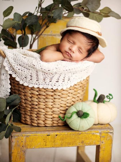 We added a little hat for a different look during this basket pose. Providing variety with simple props is part of how I make each session unique for you.
