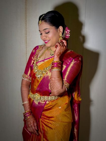 A candid moment of joy. Namratha looks absolutely radiant for her Muhurtham, with makeup that enhances her happiness without feeling heavy.