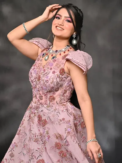 A happy and radiant shot from the same series. The makeup holds up beautifully, looking flawless and vibrant even in a more candid, expressive moment.