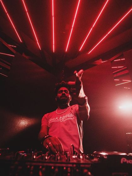 A red-lit shot of me at the console.