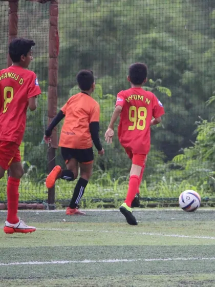 Our U13 players on the attack during a Grassroots Football Fiesta match.