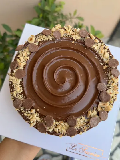 My Nutella Hazelnut Cheesecake is pure indulgence. I create a rich, creamy cold-set cheesecake swirled with Nutella, set on a crunchy biscuit base, and topped with roasted hazelnuts and chocolate chips.