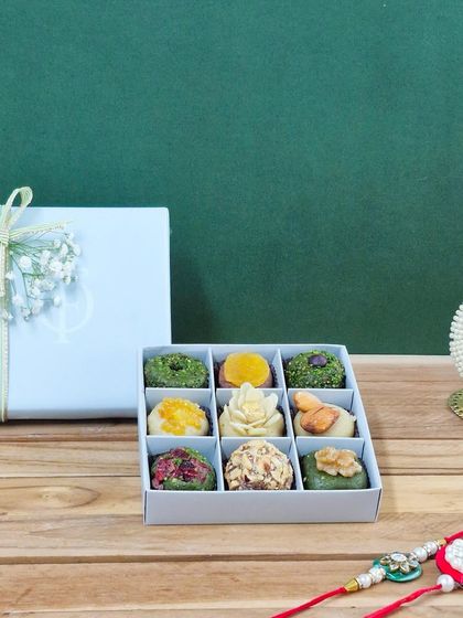 This 9-piece box showcases the artistry of our handmade dry fruit mithai. Each piece is crafted from premium ingredients like Peshawari Pistachios and California Almonds.