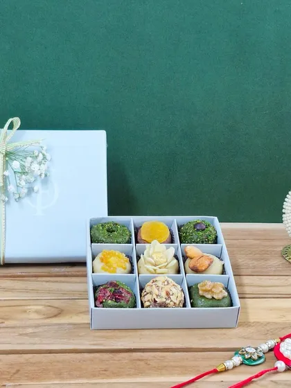 A beautiful 9-piece box showcasing the intricate designs of our artisanal dry fruit mithai. Each one is a small work of art.