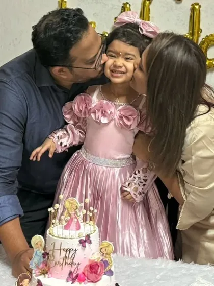 A priceless moment of a family celebrating their daughter's 3rd birthday with my Disney princess cake. The pure joy on their faces is why I love what I do.