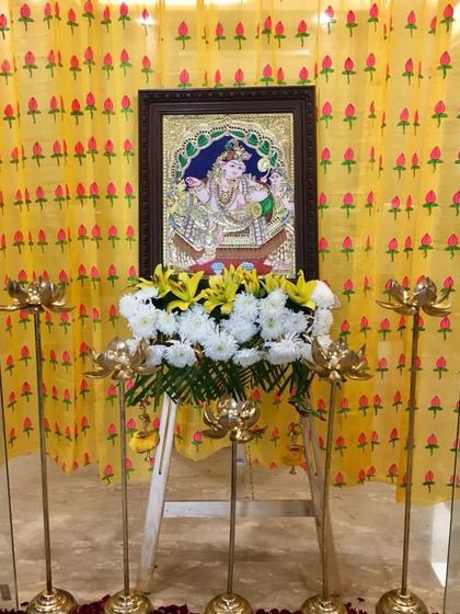 A beautiful altar setup for a 'Kanha's Kirtan'. We used a hand-painted Pichwai-style fabric from Nathdwara as a backdrop for the deity, creating a truly divine focal point.