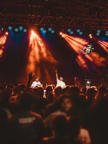 The view from the DJ booth at IIM Bangalore. The stage lights and the massive crowd create an unforgettable atmosphere.