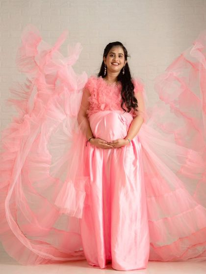 This shot showcases the full, wing-like spread of the pink maternity gown's train. It’s a perfect example of how my flying gowns can create spectacular photos.