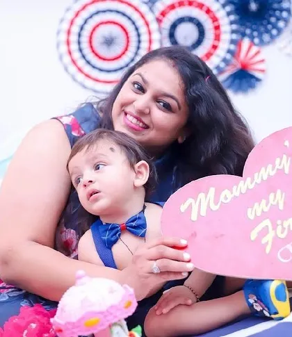 "Mommy's my First Love." A sweet moment between a mother and her son during his first birthday photoshoot, complete with a cute, heartfelt prop.