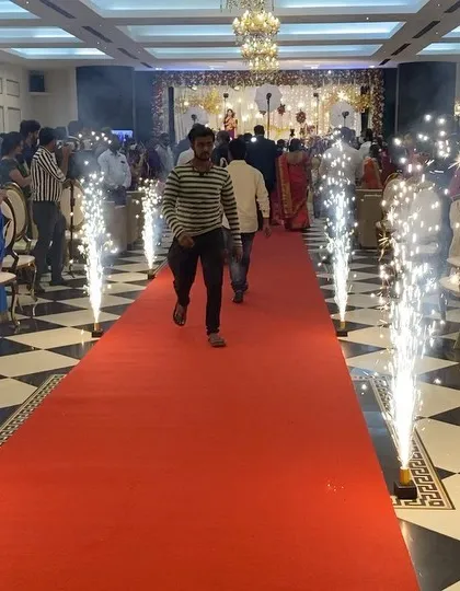 Making your entrance truly grand. We arranged this stunning red carpet walkway at CMA Palace, complete with safe, cold pyrotechnic sparklers to add a touch of glamour and excitement to the wedding reception.