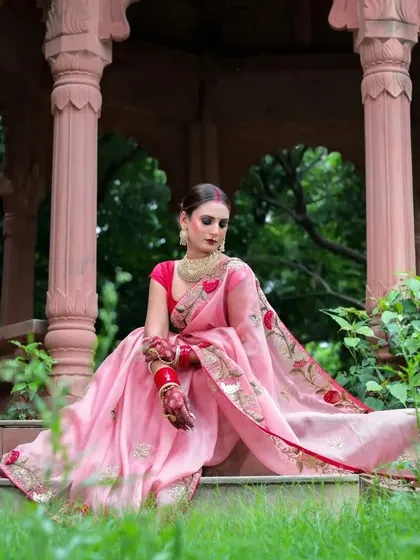 A seated portrait in a stone gazebo, the model's pose is elegant and thoughtful.