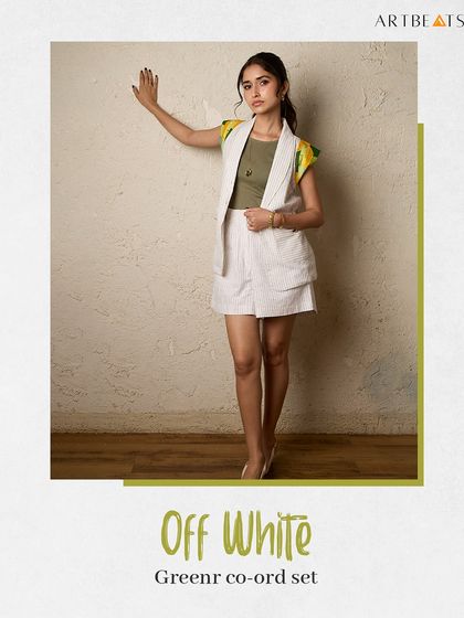 The Off-White Greener co-ord set. The art-detailed shoulders add a pop of color to the neutral, striped fabric, making it an elevated essential.