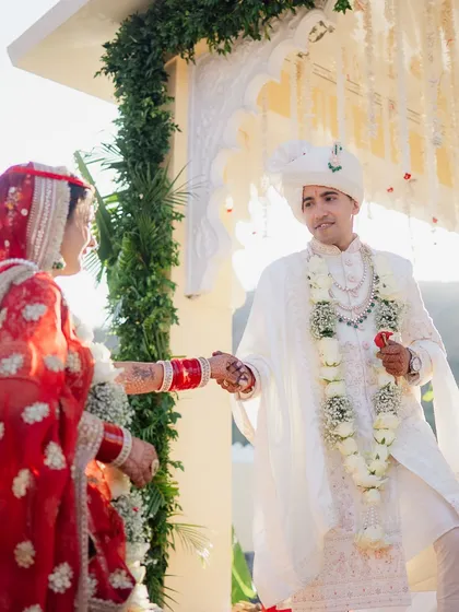 The moment the bride and groom see each other at the mandap. The exchange of looks and the holding of hands is a beautiful start to their life together.