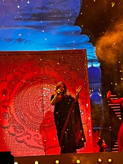 Lost in the melody on a grand stage with a beautiful, intricate backdrop. Performing live is a truly amazing feeling, a moment where I connect with every person in the audience.