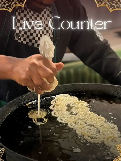I love bringing excitement to events with live food counters. Here, my chef is preparing fresh, hot jalebis, filling the air with a sweet aroma and providing guests with an interactive and delightful dessert experience.
