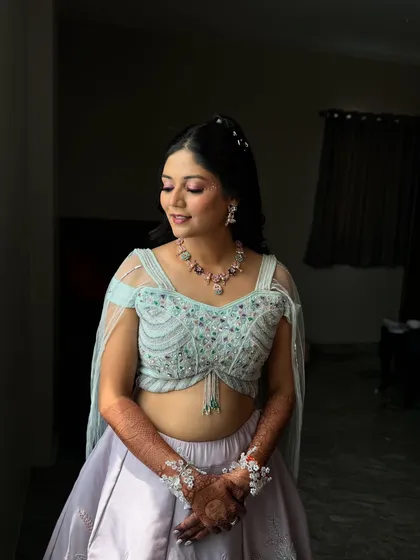 A close-up of the Haldi look, showing the delicate details of her outfit and the flawless, glowing makeup.