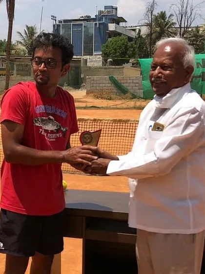 Celebrating a well-deserved win at one of our corporate tennis tournaments. It's always a proud moment to see my students succeed in a competitive match.