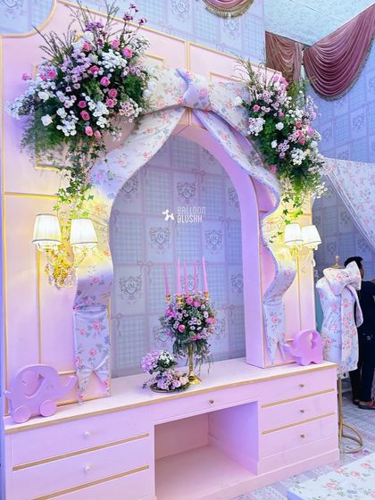 A floral-draped vanity setup, perfect for a princess-themed celebration.