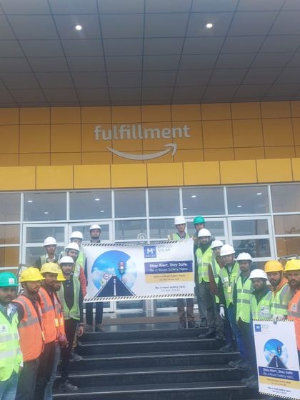 Our team at an Amazon fulfillment center after a road safety training session. We extend our safety culture to our client sites, ensuring the well-being of everyone involved in our projects.