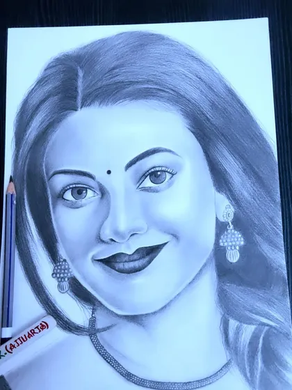 Here is my pencil portrait of actress Kajal Aggarwal, focusing on her gentle smile. I use different grades of graphite pencils to create soft shadows and highlights for a realistic effect.