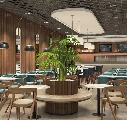 Another render for the Haldiram's project, showing the flow from the dining area to the service counters. The design uses a grid ceiling and modern lighting to create a contemporary and cohesive look.