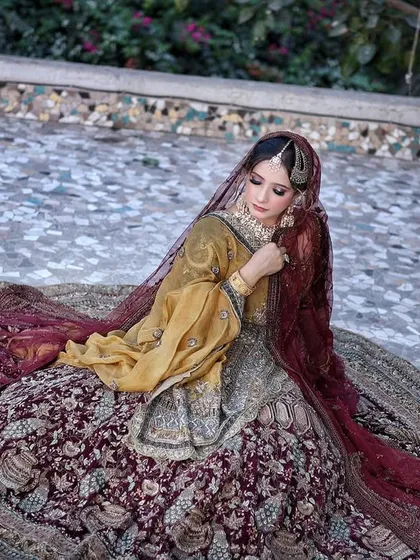 Keep it classy, keep it real. This gorgeous shot from our campaign features a regal bridal look with a stunning, wide-spread lehenga.