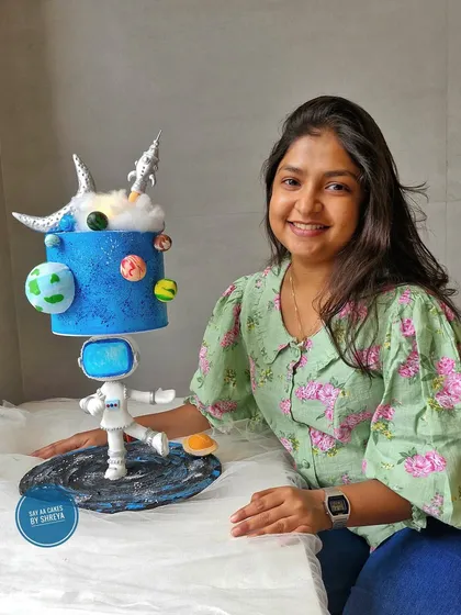 Here I am with another one of my gravity-defying creations. This astronaut cake features a custom-built structure to make the top tier float, creating a truly out-of-this-world centerpiece for a space-themed celebration.