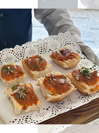 Another take on our bite sized Pav Bhaji. Here, the savory vegetable mash is served on top of small bread pieces, offering all the flavor of the classic dish in one perfect mouthful.