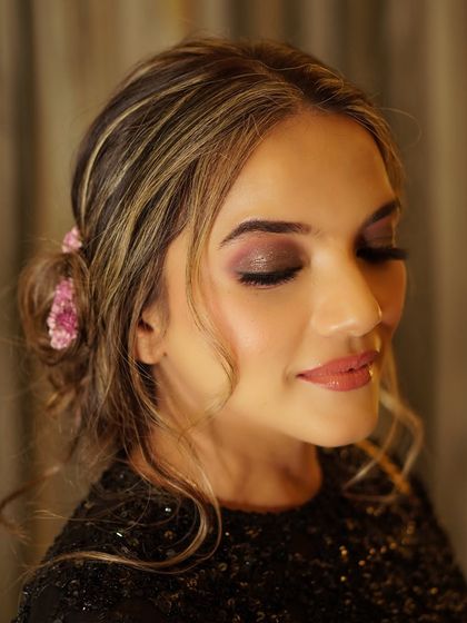 A close-up of a shimmering, smokey eye. This look is perfect for an evening event, adding a touch of drama and sophistication while still feeling soft and blended.