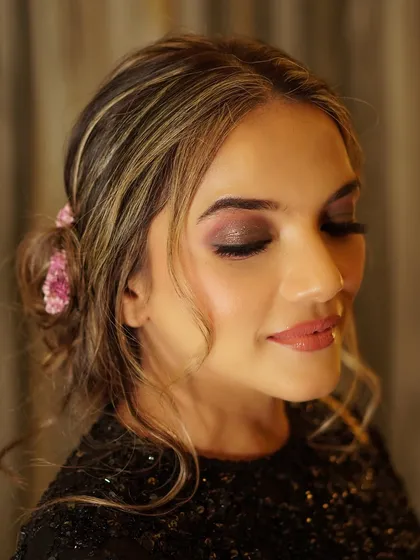 A close-up of a shimmering, smokey eye. This look is perfect for an evening event, adding a touch of drama and sophistication while still feeling soft and blended.